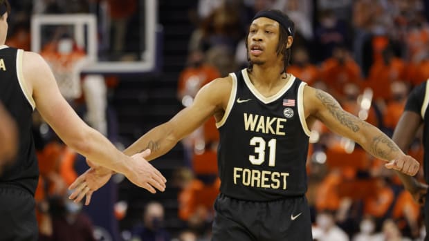 Jan 15, 2022; Charlottesville, Virginia, USA; Wake Forest Demon Deacons guard Alondes Williams (31) celebrates with Demon Deacons forward Jake LaRavia (0) against the Virginia Cavaliers during the second half at John Paul Jones Arena. Mandatory Credit: Geoff Burke-USA TODAY Sports